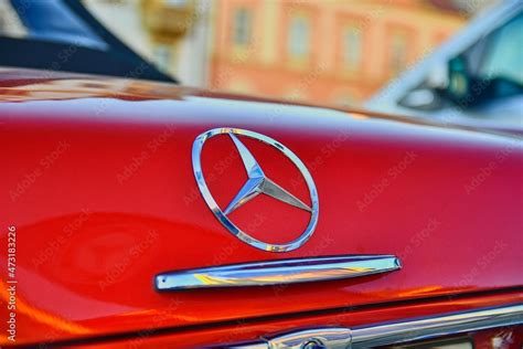 Mercedes Benz logo on a red vintage car. Close-up. Mercedes-Benz is a ...