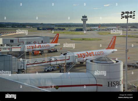 EasyJet aircraft at gates, North Terminal, London Gatwick Airport ...