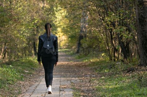 Lonely Girl is Walking Along the Alley of the Park. Back View Stock Image - Image of relax ...