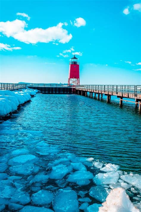 Charlevoix, MI /USA - March 3rd 2018: Small Icebergs Melting at the South Pier Lighthouse Off of ...