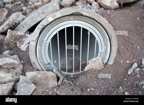 Sewer Pipe Entrance security Grille Gate Barred Stock Photo - Alamy