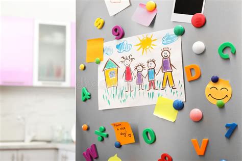 Sheets of Paper, Child`s Drawing and Magnets on Refrigerator Door in ...