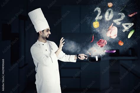 Chef with 2024 numbers in the kitchen Stock Photo | Adobe Stock