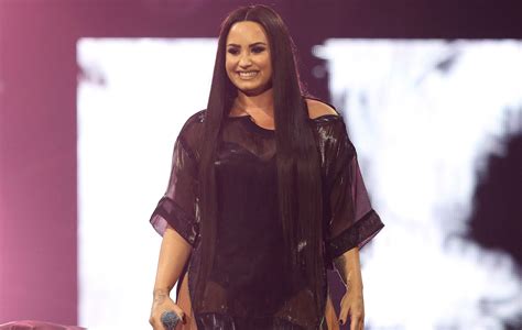 Demi Lovato hits back at fan who called her team "rotten" for firing ...