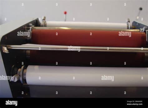 Plastic laminating machine Stock Photo - Alamy