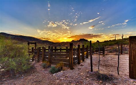 Desolate Beauty, fence, hills, rocks, corral, sunrise, clouds, brush, field, HD wallpaper | Peakpx