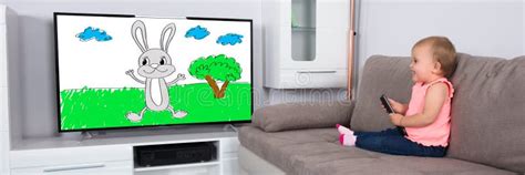 Baby Watching TV Cartoon stock image. Image of film - 260585991