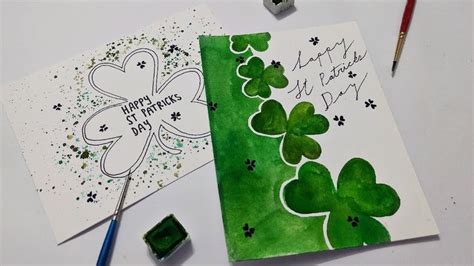 two st patrick's day greeting cards on a table with markers and pencils