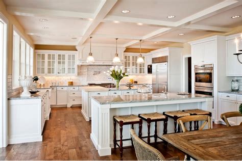 This kitchen has beige walls, white cabinets, and gray and white marble. | Kitchen layout ...
