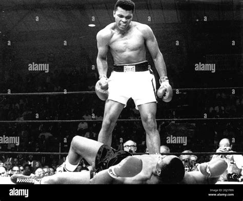 (Muhammad Ali) Cassius Clay in the boxing ring standing over Sonny Liston 1965 Stock Photo - Alamy