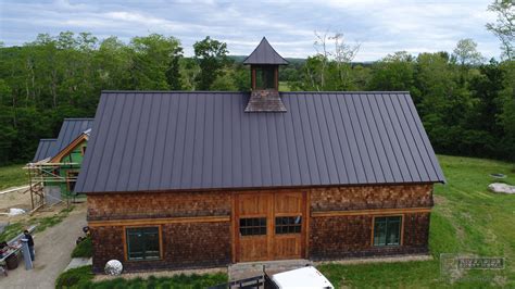 Matte black kynar aluminum metal roofing with cupola and curved panels