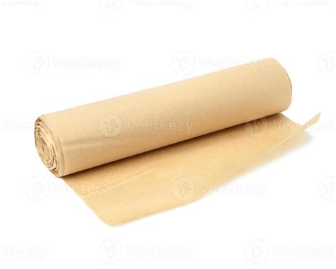 roll of brown parchment paper isolated on white background, for baking ...