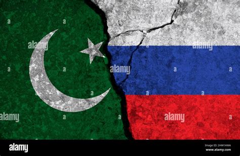 Political relationship between Pakistan and russia. National flags on cracked concrete ...