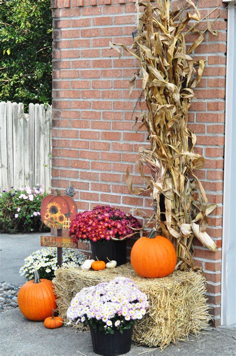 Outdoor fall decor - mums, hay bale, pumpkins, Harvest sign, corn stalks & bundle of indian corn ...