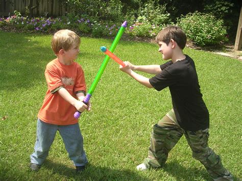 Boys sword fighting Free Photo Download | FreeImages