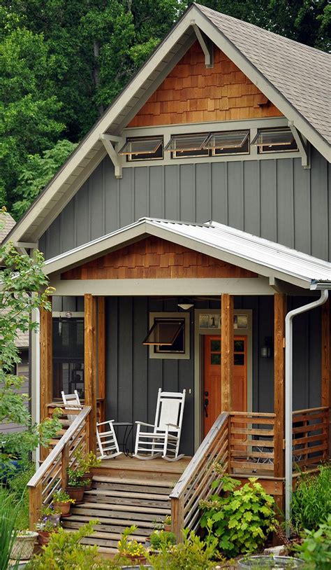 Vertical siding with natural wood colored scalloped siding. Pretty. #remodelingamobilehome ...