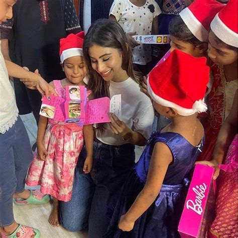 Mouni Roy soaks in the X'Mas spirit as she enjoys a party with children ...