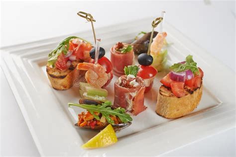 Gourmet Appetizing Food On Square Plate Stock Photo - Image of assortment, background: 43883132