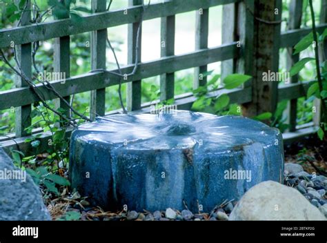 Millstone water fountain Stock Photo - Alamy