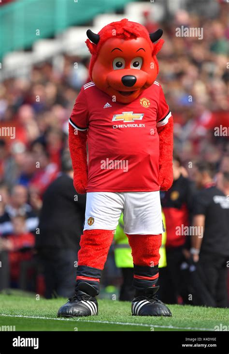 Manchester United mascot Fred the Red on the pitch Stock Photo - Alamy