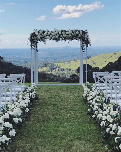 Garden Wedding Ceremony Arch with White Flowers and Greenery