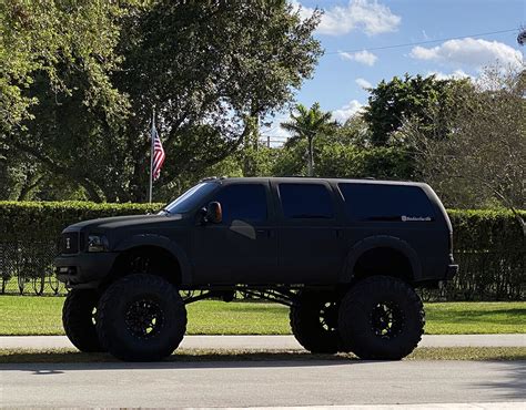 Lifted 2004 Ford Excursion Monster Truck On 49” Super Swampers - offroadium.com