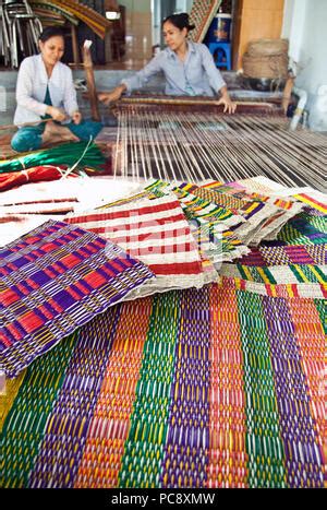 Vietnamese women weaving mats at a craft factory in Hoi An Vietnam ...