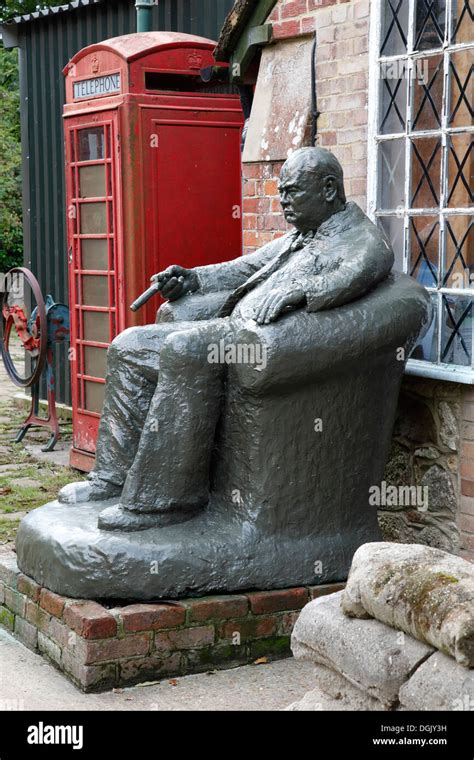 Statue of Sir Winston Churchill seated with cigar in hand Isle of Wight, Hampshire, England ...