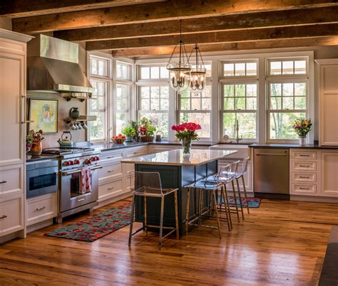 Rustic Farmhouse kitchen with blue island and window bay Rustic