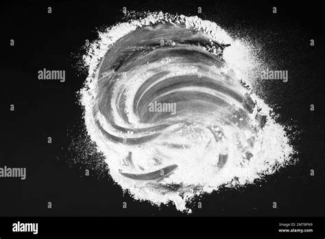 Scattered flour on black table, top view Stock Photo - Alamy