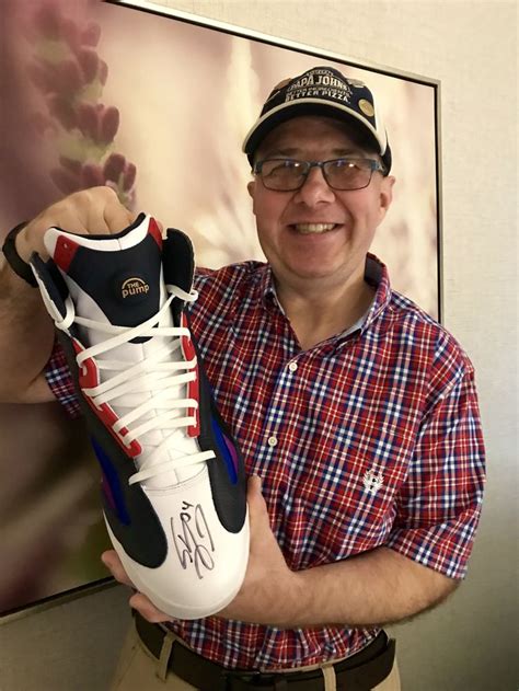 Casey holding autographed Shaquille O'Neal shoe awarded to him as a ...