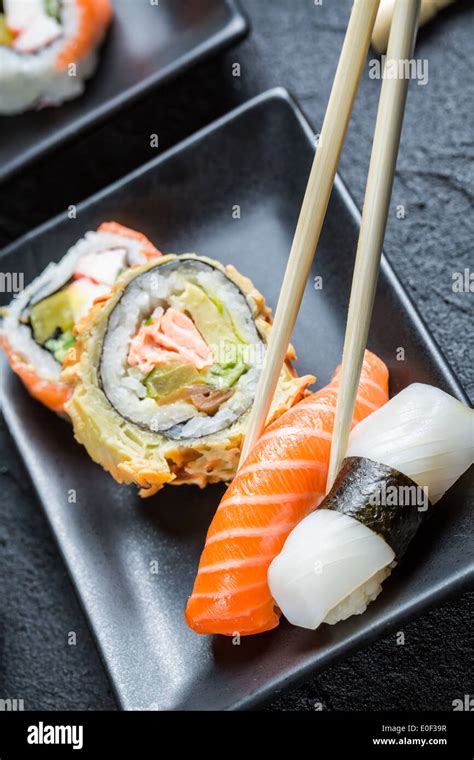 Sushi eaten with chopsticks Stock Photo - Alamy