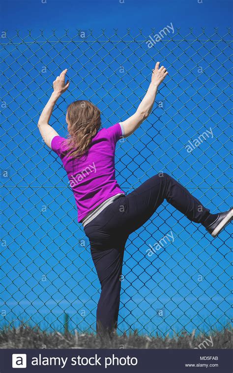 Woman hand holding on chain link fence for remember Human Rights Day concept Stock Photo - Alamy