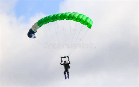 A Skydiver Performing Skydiving with Parachute Editorial Stock Photo - Image of floats, aerial ...