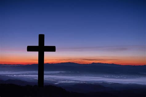 Silhouette of cross on mountain sunrise background. 7778081 Stock Photo at Vecteezy