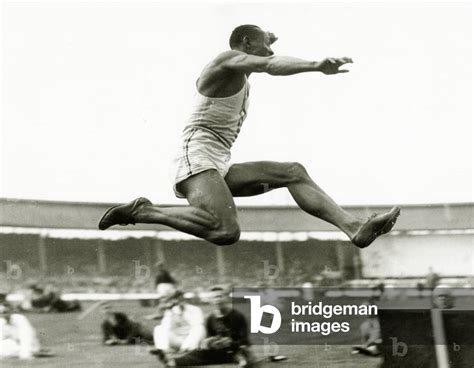 Jesse Owens in action at the long jump during the Berlin Olympics, 1936 ...