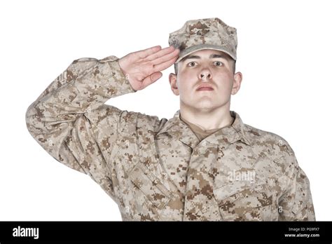Saluting and smiling army soldier studio shoot Stock Photo - Alamy