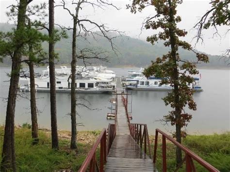 there are many boats docked in the water at this dock, and one boat is ...