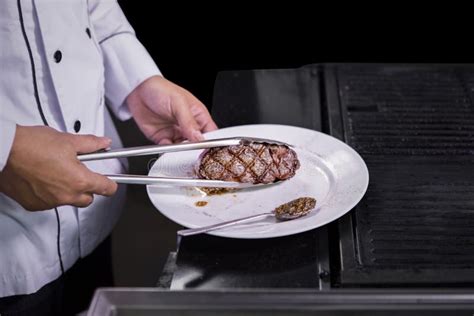 Chef cooking beef steak stock photo. Image of restaurant - 96584758