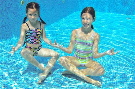 Two Girls Underwater in Swimming Pool Stock Photo - Image of conceptn ...