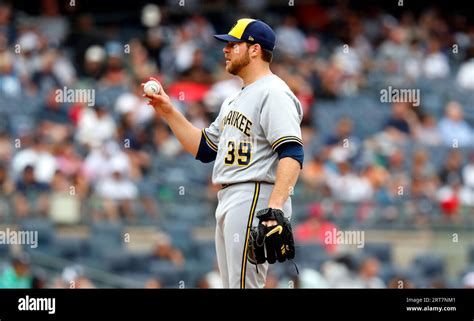 Milwaukee Brewers starting pitcher Corbin Burnes (39) pauses before pitching against the New ...