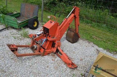 backhoe attachment - Sheridan Realty & Auction Co.