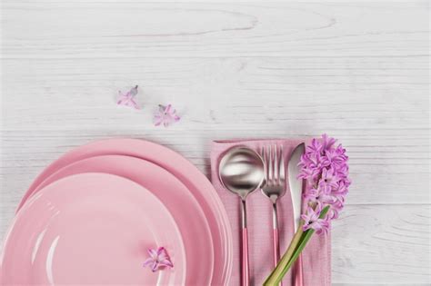 Premium Photo | Pink rustic table setting with purple hyacinth flower ...