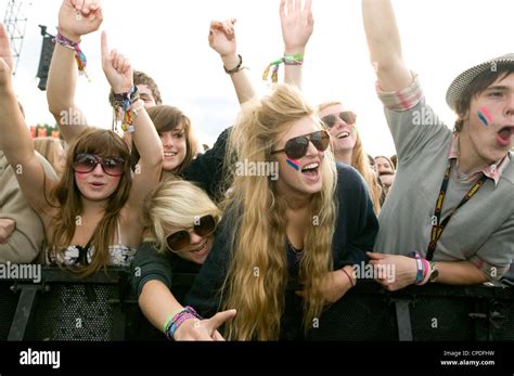 Crowd in front row screaming at a music concert Stock Photo - Alamy