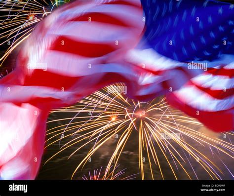Waving American flag with fireworks Stock Photo - Alamy