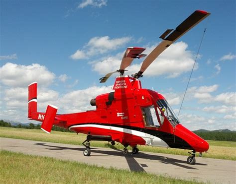 Unmanned K-MAX helicopter demonstrates dropping water on a fire - Fire Aviation