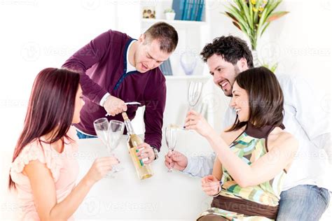 Cheerful Friends Drinking Wine 14233743 Stock Photo at Vecteezy