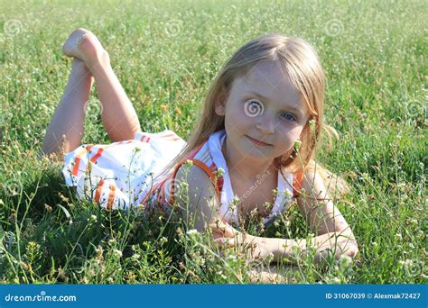 Portrait of Little Girl Lying on the Grass Stock Image - Image of life ...