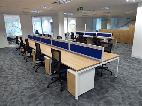 New open plan office space with blue desk dividers separating the ...