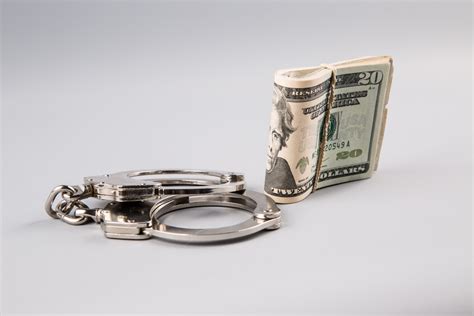 Handcuffs And Money Free Stock Photo - Public Domain Pictures